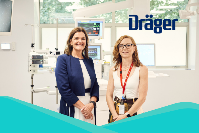 features Victoria Roberts, Sales and Marketing Director, Draeger Medical UK; Pia Larsen, Chief Procurement Officer, Guy's and St Thomas' NHS Foundation Trust standing infront of a medical diagnostic machine